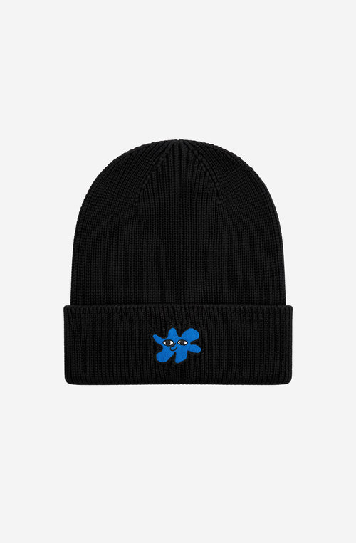 Gorro de punto negro Kaotiko Breeze Black con vuelta ancha y bordado azul de una figura con ojos.
