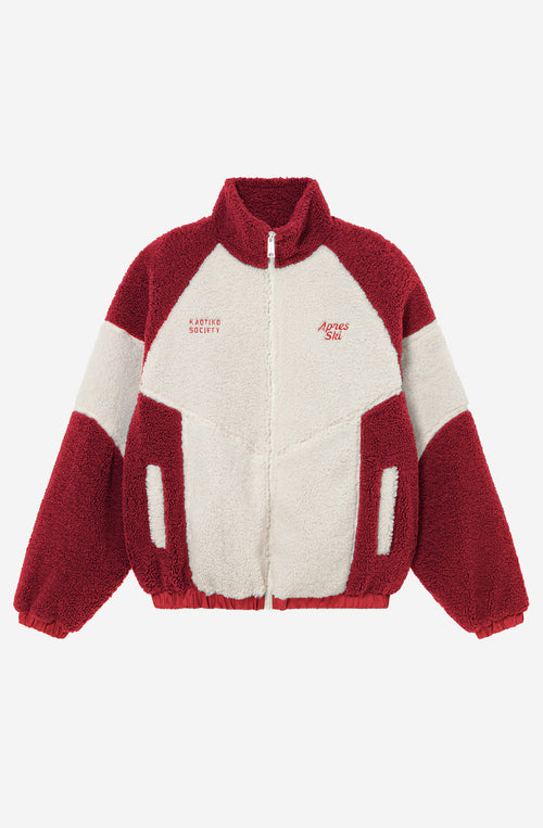 Polar fleece de tejido sherpa en marfil y rojo con cremallera, cuello alto y bordados Après Ski y Kaotiko Society.