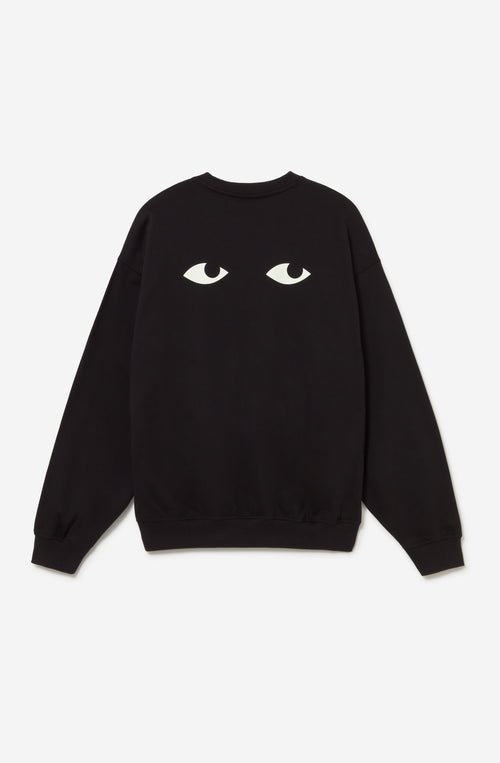 Jersey oversize unisex negro con gráfico de ojos en la espalda.
