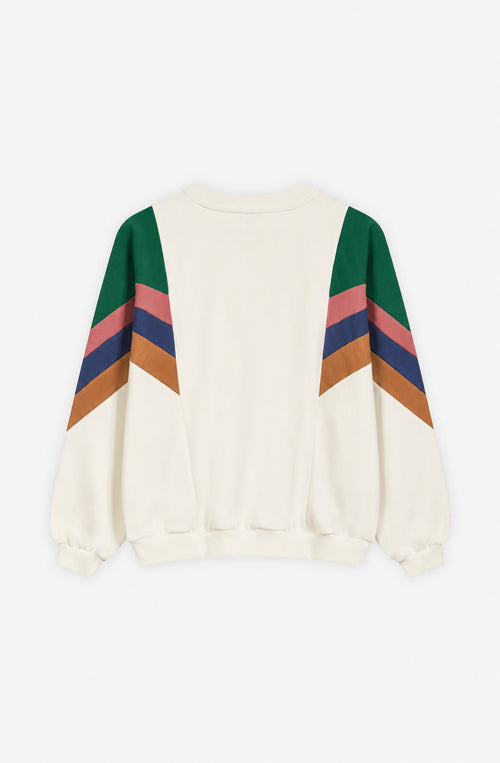 Sudadera unisex Ginger en color crudo con franjas diagonales verdes, rosas, azul marino y naranja en las mangas, cuello redondo y logo Kaotiko en el pecho.