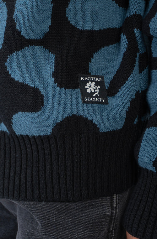Cardigan unisex de punto con diseño jacquard azul y negro.