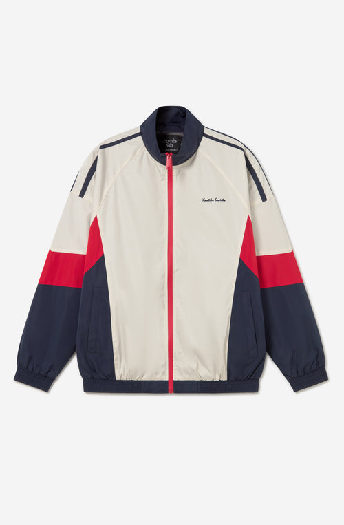 Chaqueta Retro Ski en marfil, rojo y azul marino con diseño color block, cremallera roja y logo Kaotiko Society.