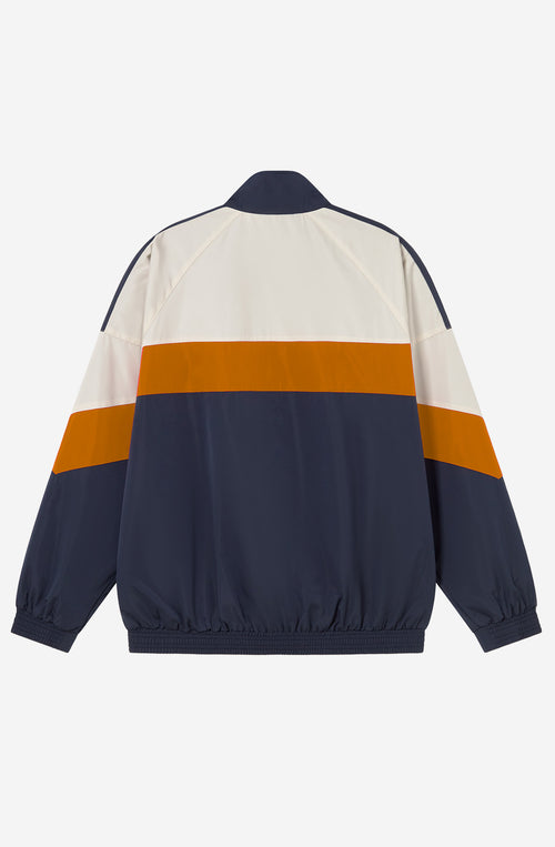 Chaqueta Retro Ski en marfil, vanilla y azul marino con diseño color block, cremallera a contraste y logo Kaotiko Society.
