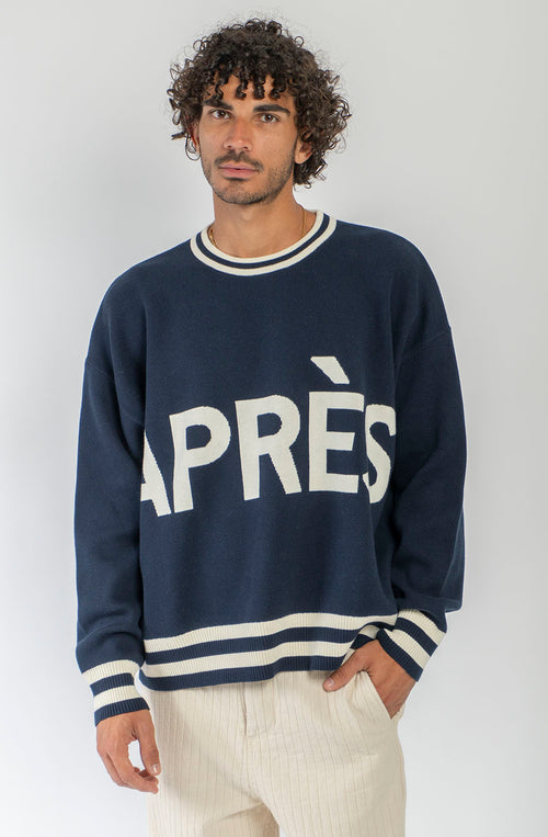 Jersey unisex azul marino de punto con gráfico APRÈS en el frontal, SKI en la espalda y detalles de canalé a contraste.